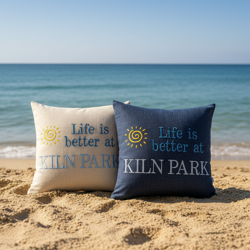 Cream and blue Kiln Park cushions on sand