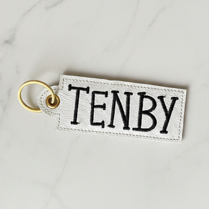 Tenby keyring on white marble background